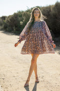Made by Mortals women’s Jardin de Rose Mini Dress with billowy sleeves, hand block printed cotton bohemian dress in black with white, blue and pink floral pattern.