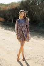 Made by Mortals women’s Jardin de Rose Mini Dress with billowy sleeves, hand block printed cotton bohemian dress in black with white, blue and pink floral pattern.