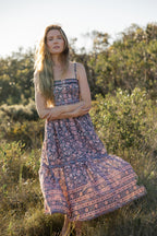 Made by Mortals women’s Jardin de Rose Midi Dress, bohemian strappy dress in black with white, blue, and pink floral, hand block printed cotton.