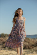 Made by Mortals women’s Jardin de Rose Midi Dress, bohemian strappy dress in black with white, blue, and pink floral, hand block printed cotton.
