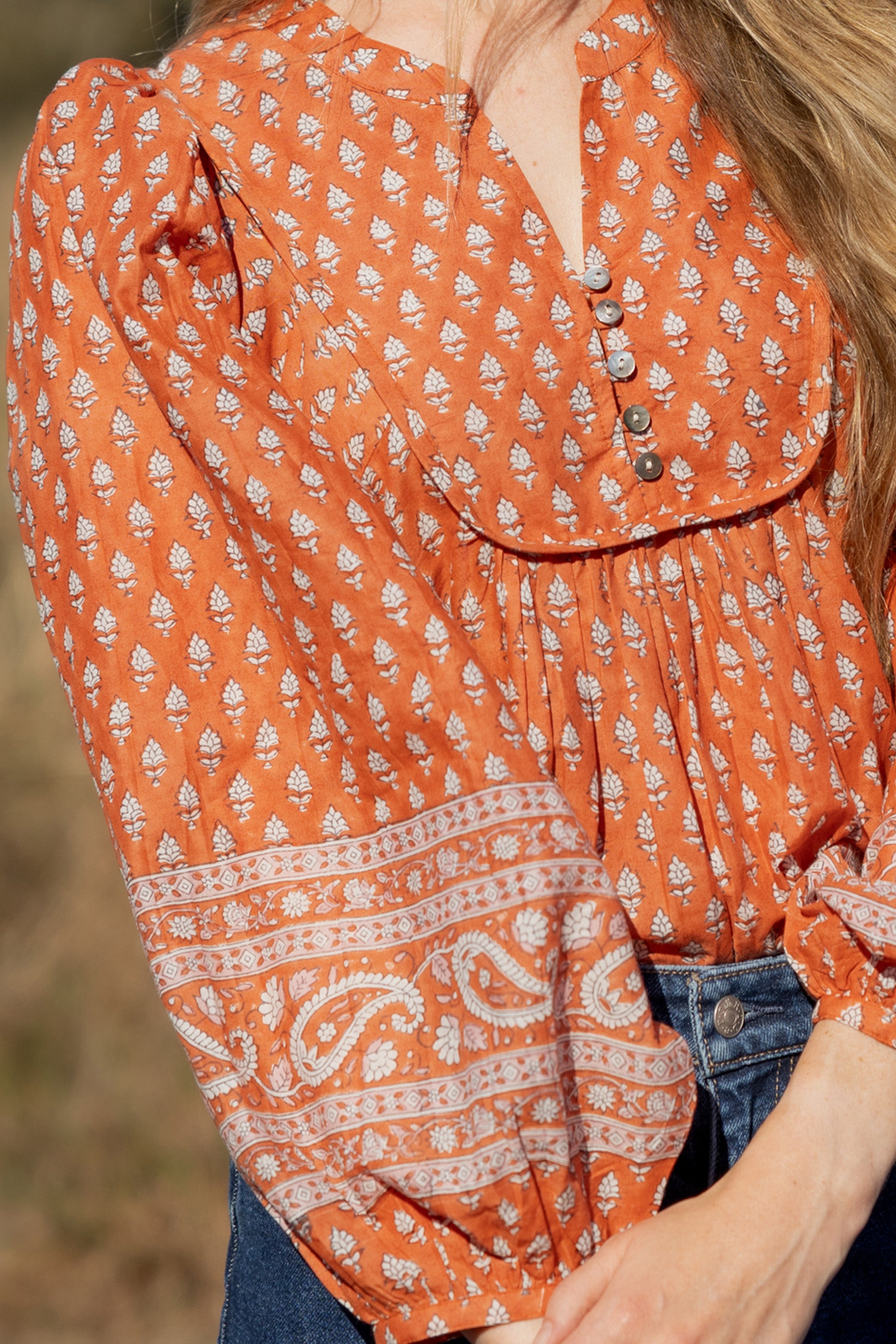 Made by Mortals women’s Desert Bloom Blouse with billowy sleeves, hand block printed bohemian cotton blouse in rust.