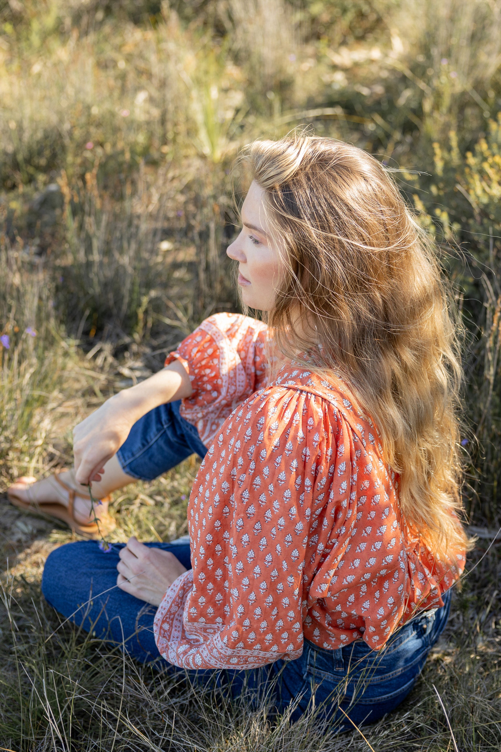 Made by Mortals women’s Desert Bloom Blouse with billowy sleeves, hand block printed bohemian cotton blouse in rust.