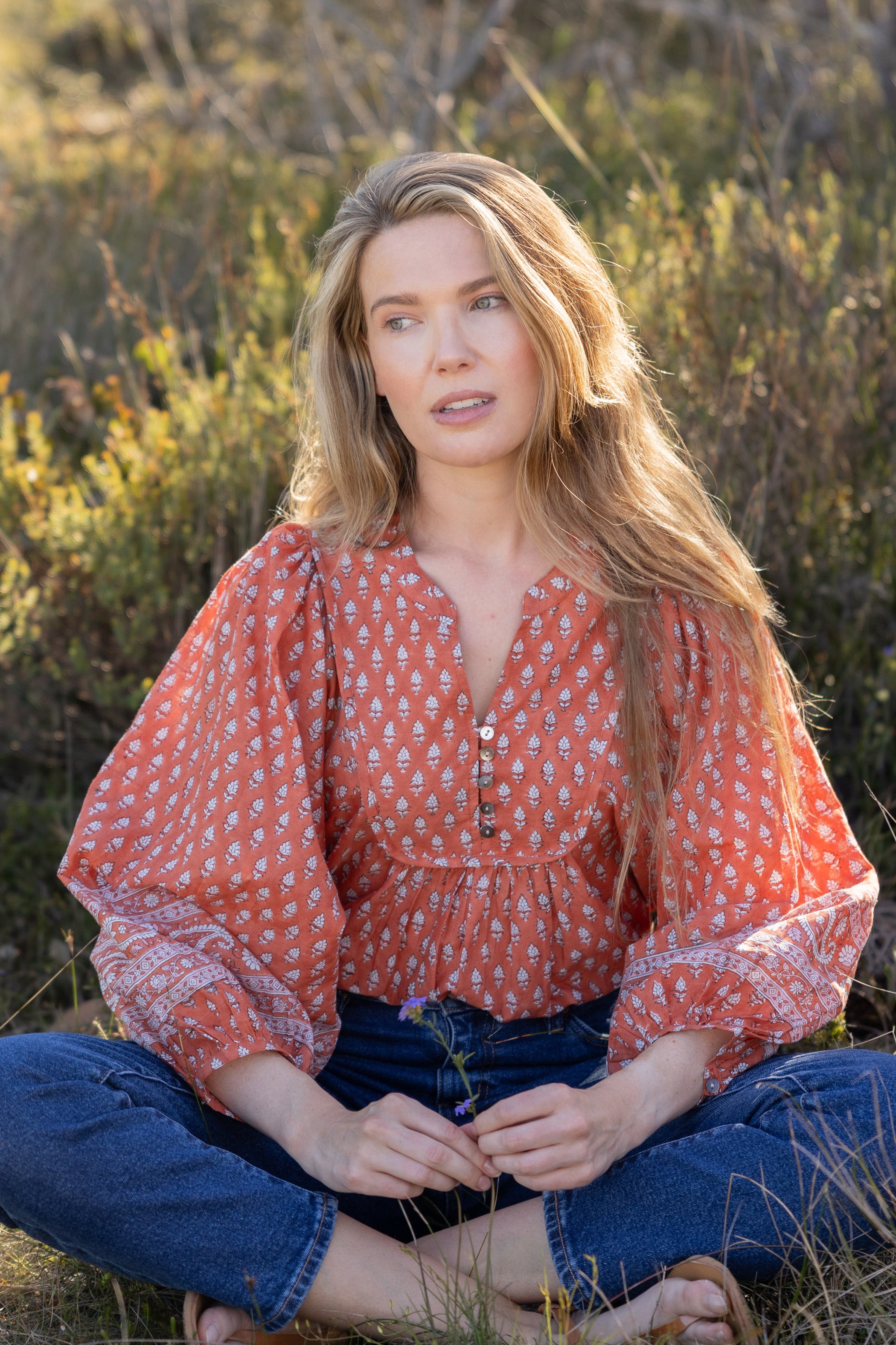Made by Mortals women’s Desert Bloom Blouse with billowy sleeves, hand block printed bohemian cotton blouse in rust.